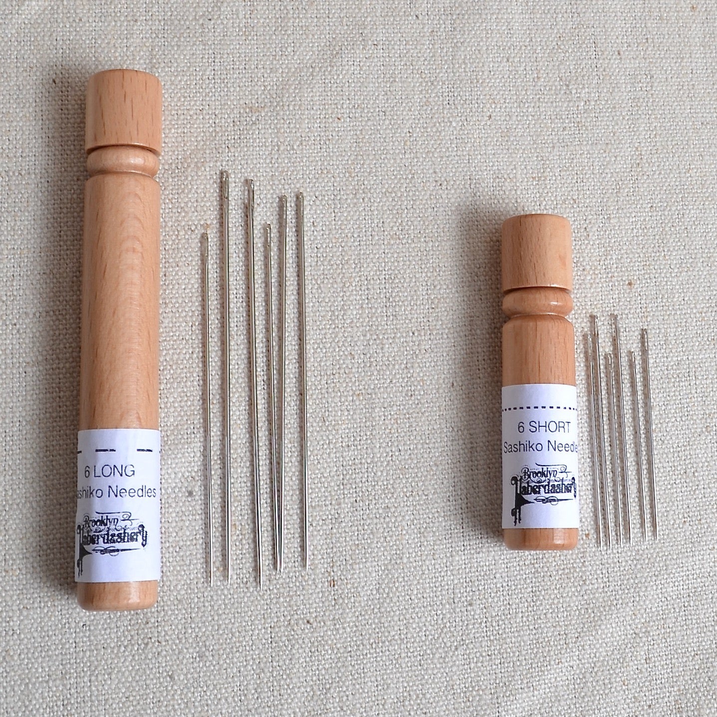 Hand stitching needle in wood storage case