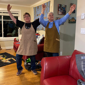 silly friends showing off their aprons