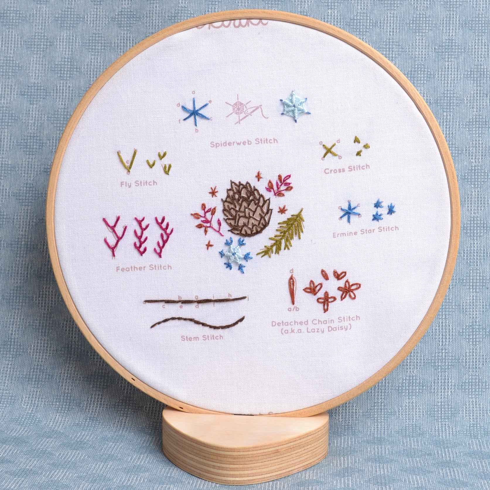 Embroidery sampler shown in hoop prop