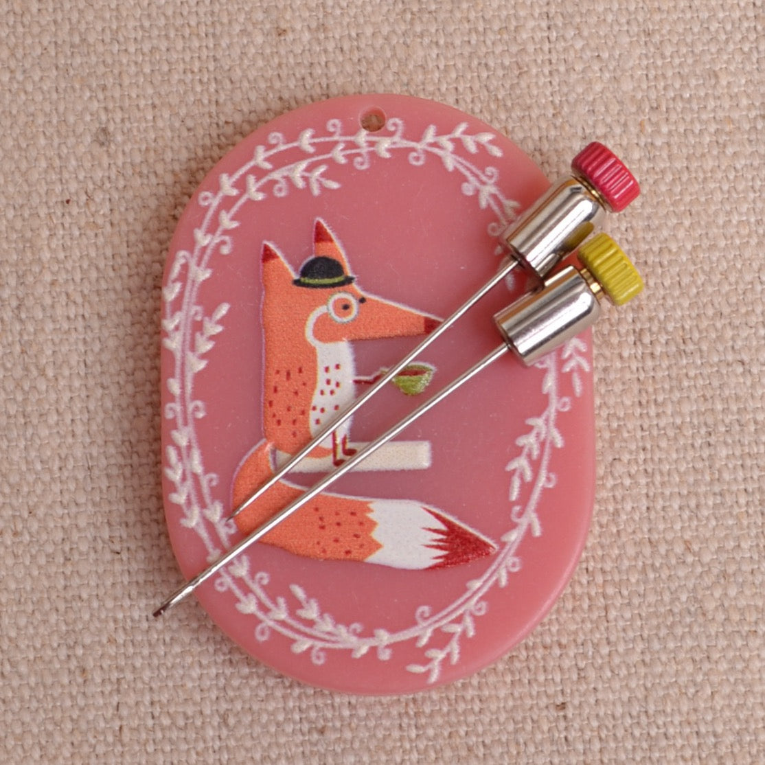Embroidery needles with Little  House Needle Caps on magnetic needle minder