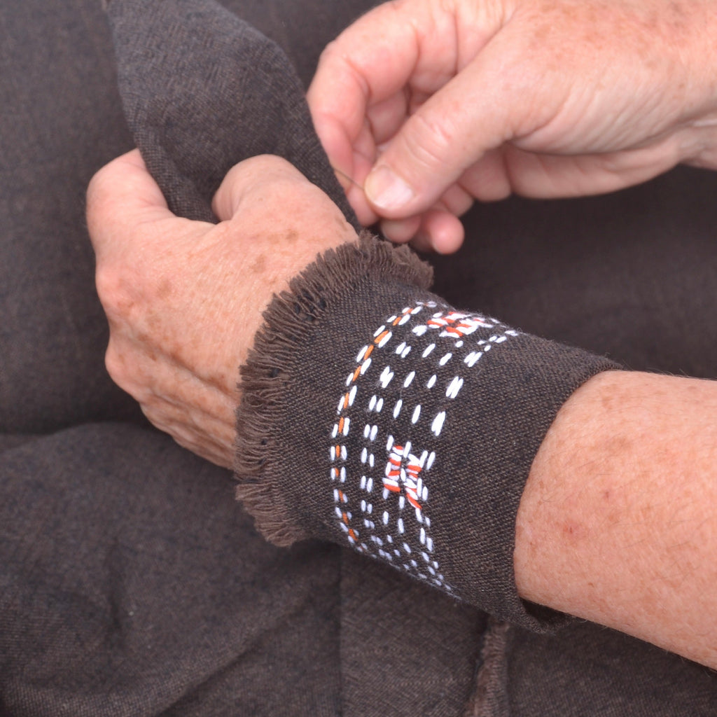 rustic fabric wrist cuff with stitching 