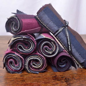 A mixed assortment of solid-colour cotton fabric pieces selected for visible mending, sashiko patches, stitch books, slow stitching and other hand-stitching projects.