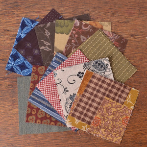 multiple fabric swatches with different patterns and colors, including japnese printed fabrics