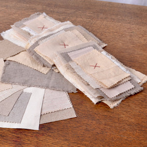 A beautiful collection of small pieces of assorted textures and colours of linen and cotton fabrics for mending or for hand stitchings.