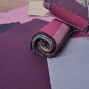 An assortment of  cotton fabric pieces selected for visible mending, sashiko patches, stitch books, and other hand-stitching projects.
