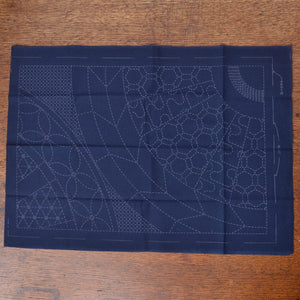 This placemat design uses the spokes of a wheel to frame as an interesting and enjoyable way to show off this collection of&nbsp; traditional sashiko motifs.
