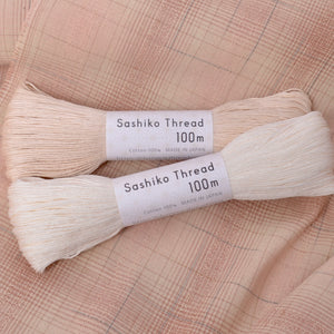 Dyed Yarn Cotton Fabric for Sewing and Quilting shown with 100 meter skiens