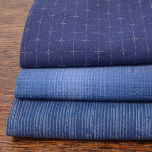 Bundle of three fat quarter pieces of yarn-dyed 100% cotton fabric 