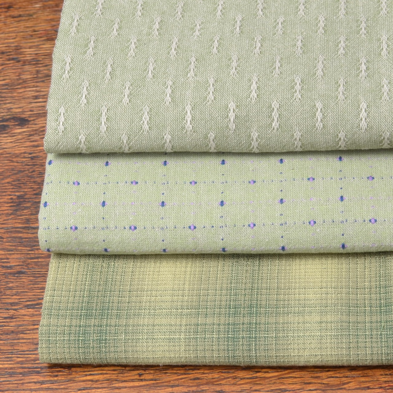 Bundle of three fat quarter pieces of yarn-dyed 100% cotton fabric