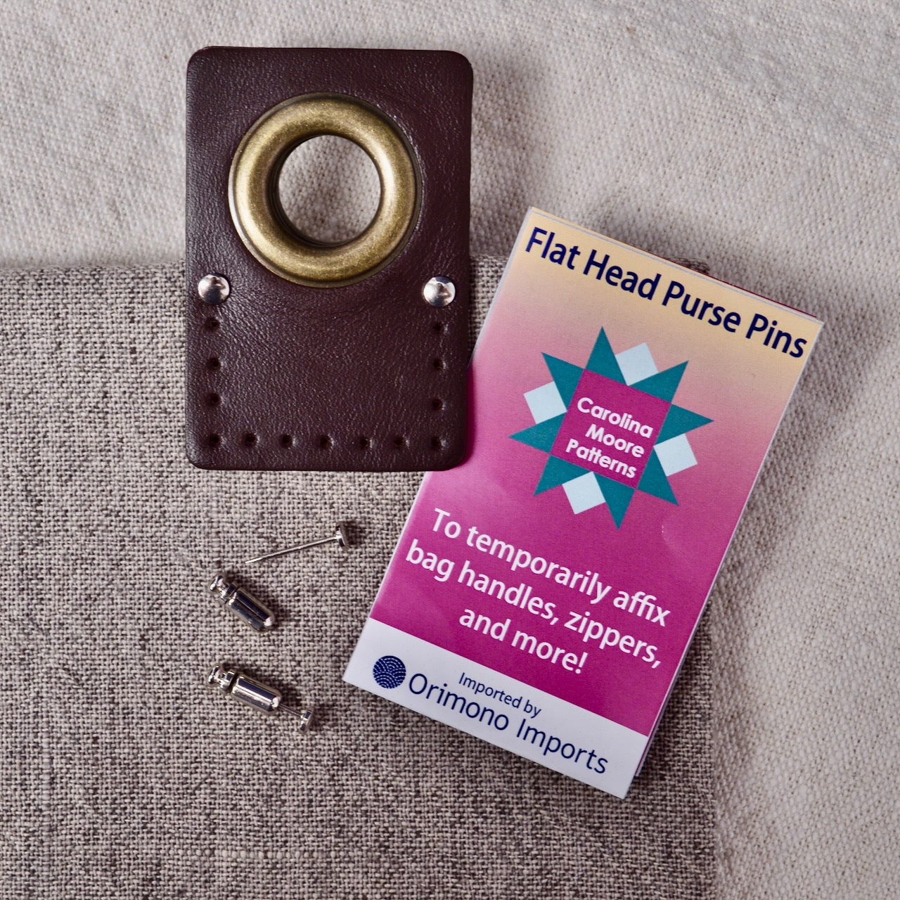 Flat Head Purse Pins showing flat head side of pins holding leather bag attachment in place