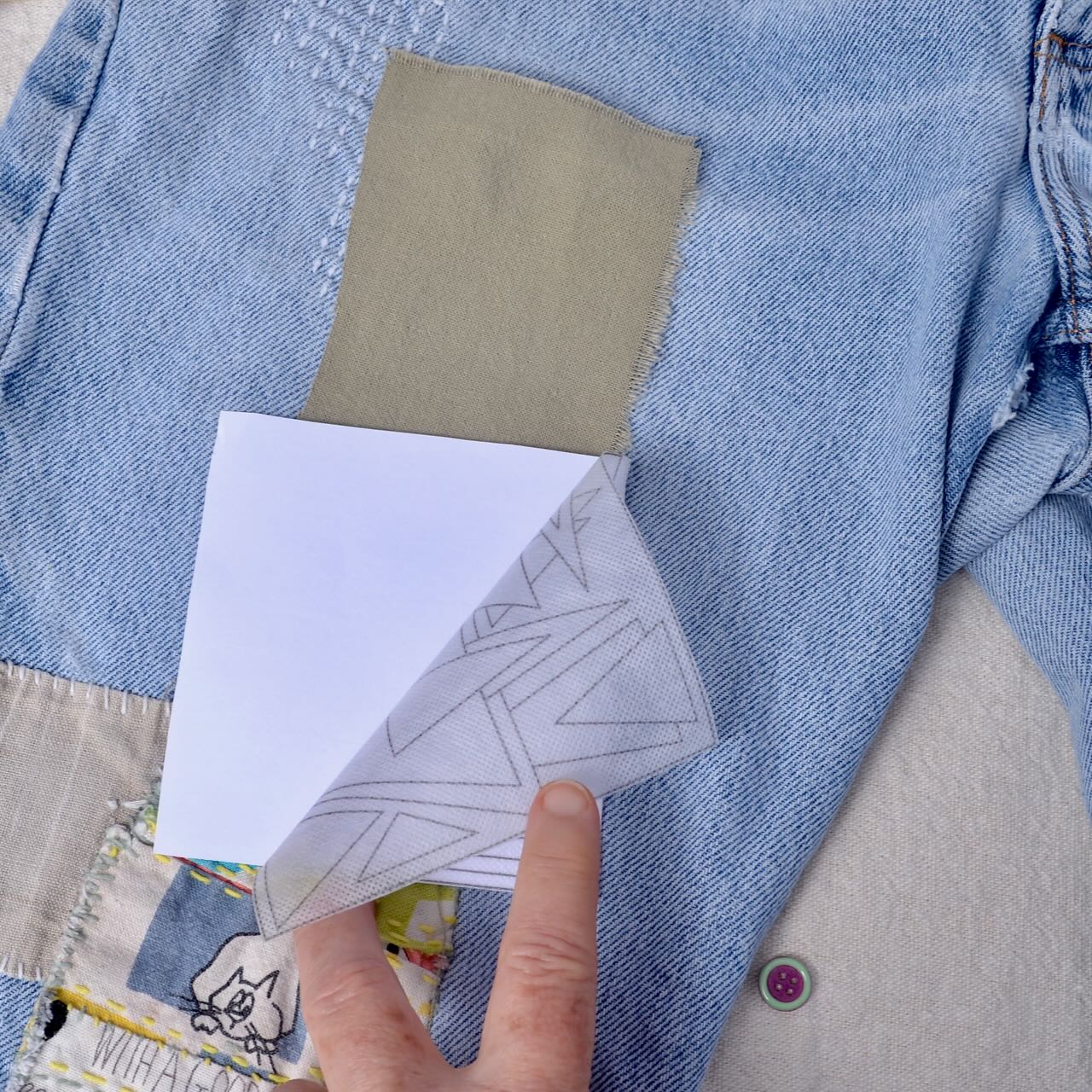 Showing how to peel backing on Dissolvable Stick & Stitch Transfer Patterns "Geometrics"