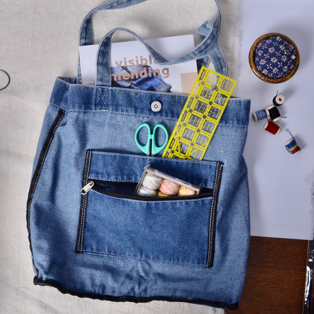 inside of denim bag with pockets and magnetic closure