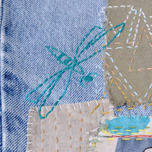 Peel, Sick & Stitch "Sashiko Dragonflies" on worn bue jeans