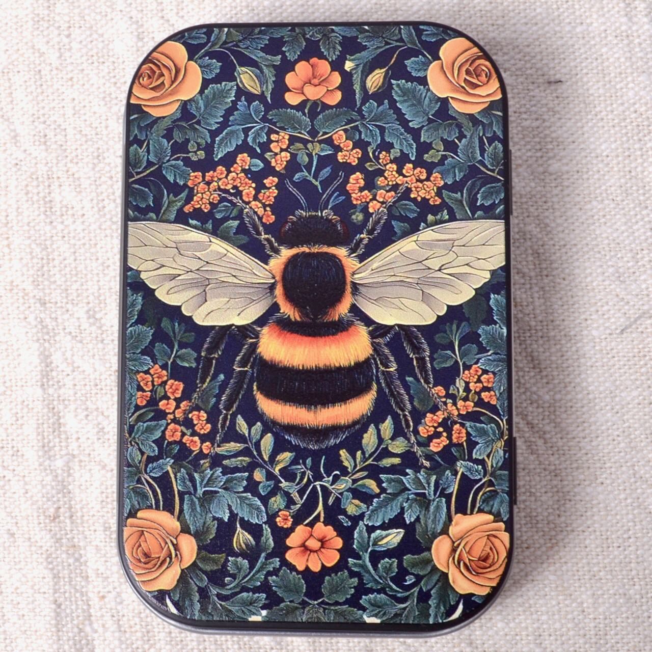 Decorative small tine with bumblebee in flowers