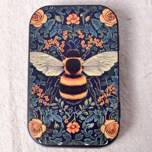 Decorative small tine with bumblebee in flowers