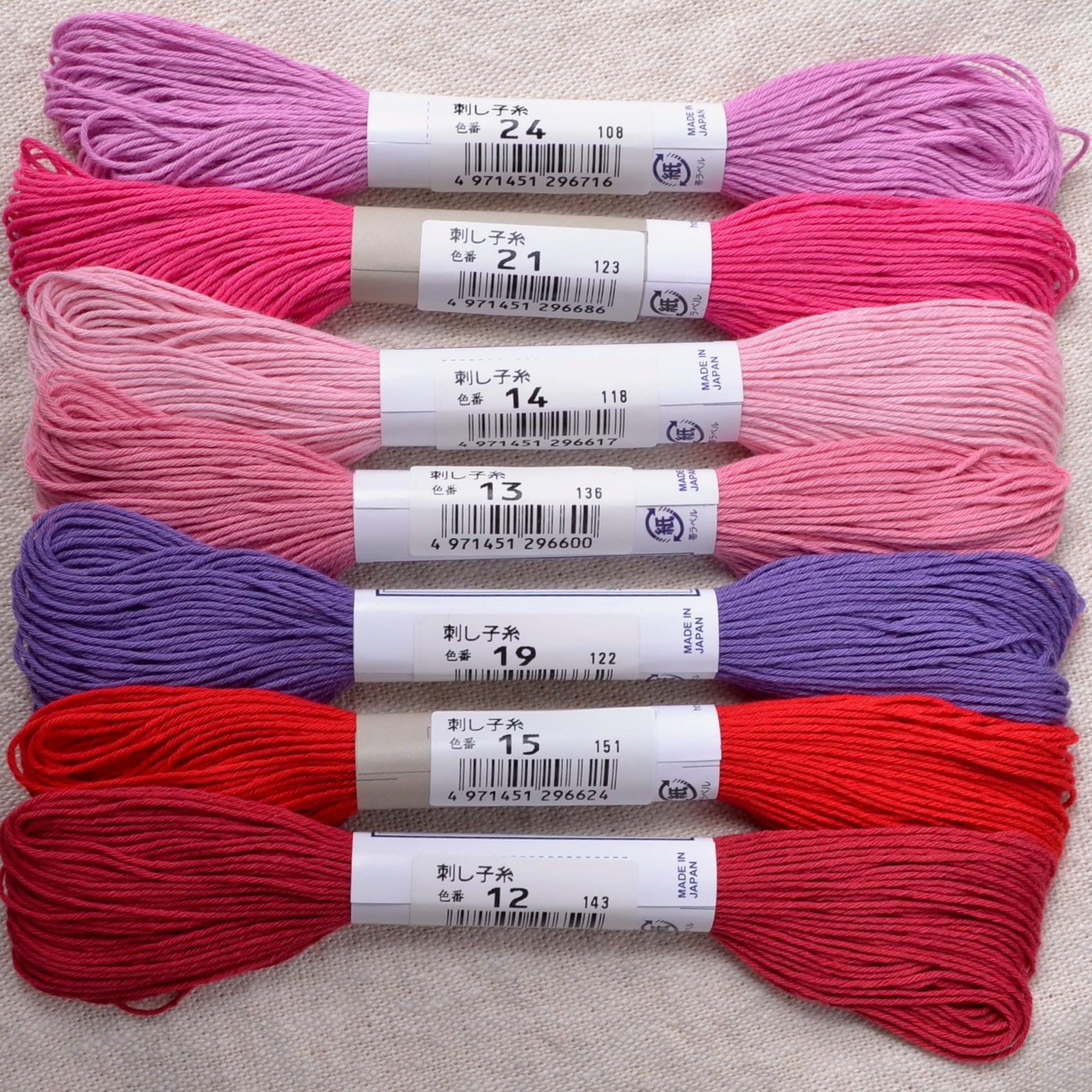 sashiko thread, pinks, reds, purple