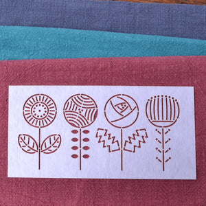 Ramie fabric pieces for  stitching shown with stencil