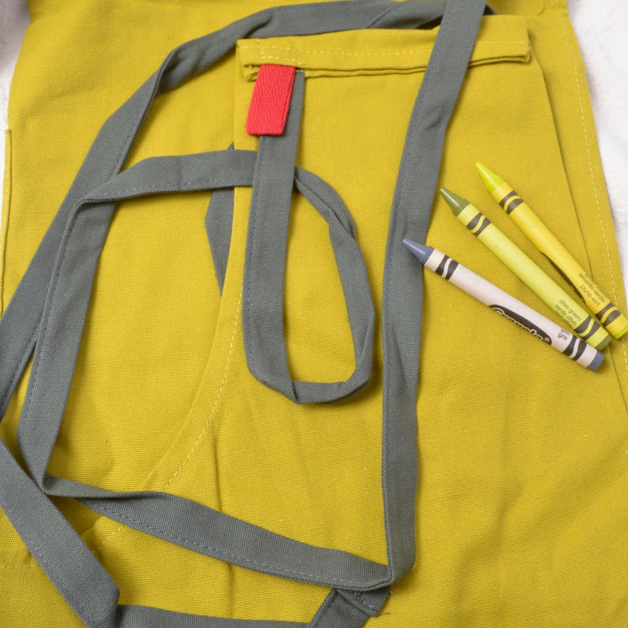 mustard and olive apron for kitchen or studio use