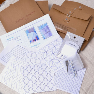 Sashiko stitching kit with patterns, needle, needle threader, reusable brown envelope