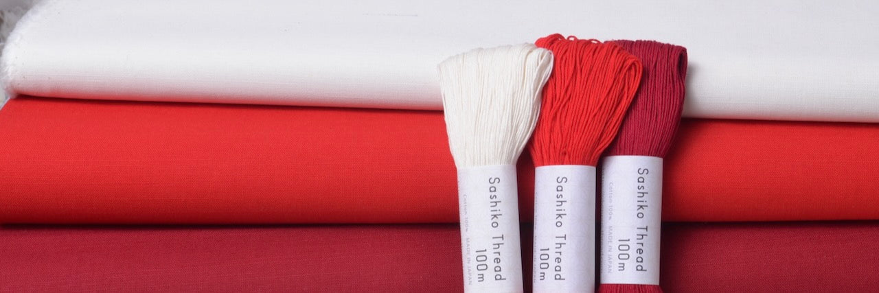 red and white sashiko threads and fabric for sashiko stitching