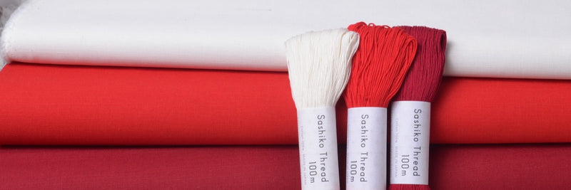 red and white sashiko threads and fabric for sashiko stitching