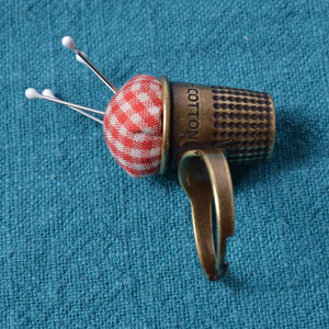 side of Little House pin cushion ring in thimble