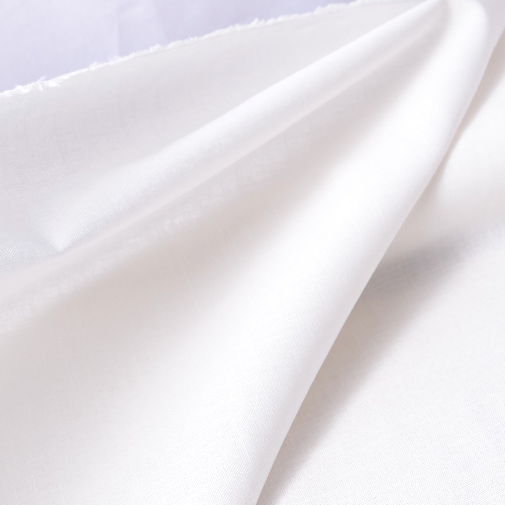 white cotton stitching and sdwing fabric