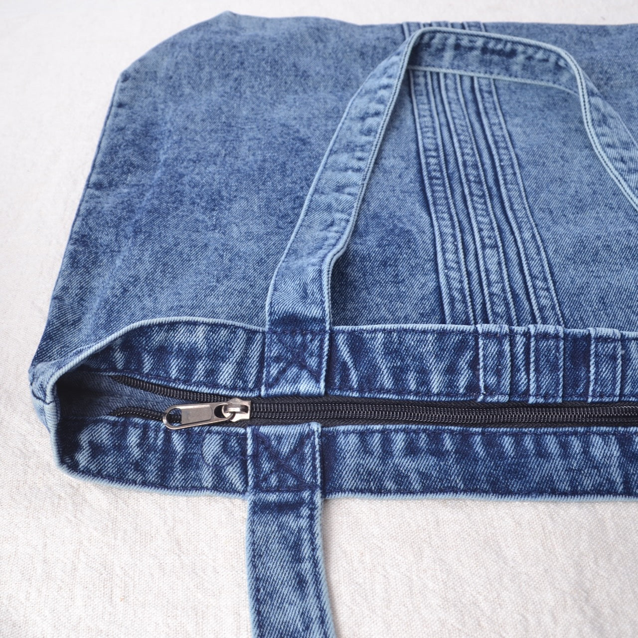 Showing denim bag zipper