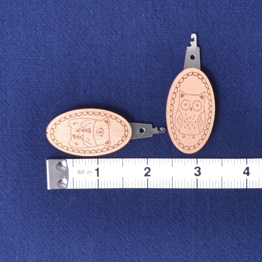 needle threader with tape measure for size