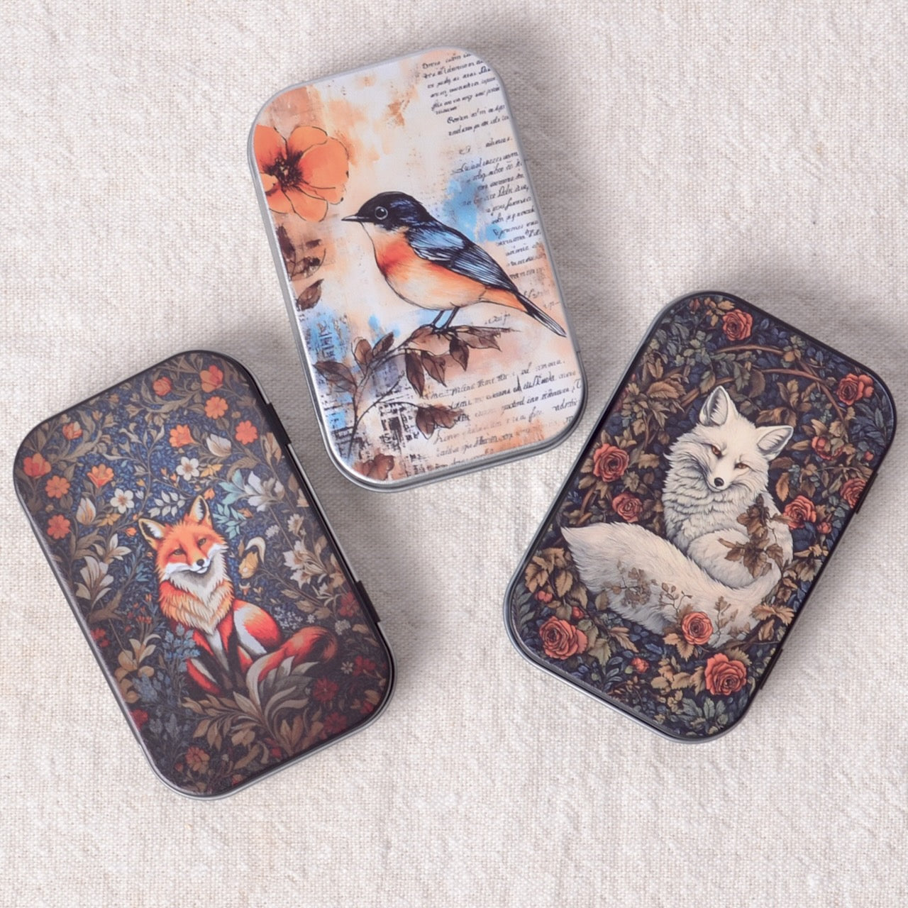 various small tins, foxes and a bird
