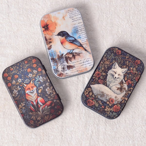 various small tins, foxes and a bird
