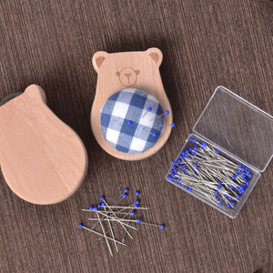 showing all sides ofSolid Wood Pincushion with pins "Blue Bear"