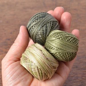 green cotton threads, suitable for hand stitching projects