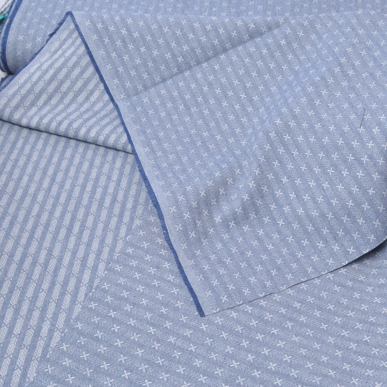 blue dyed yarn cotton fabric for sewing showing both sides