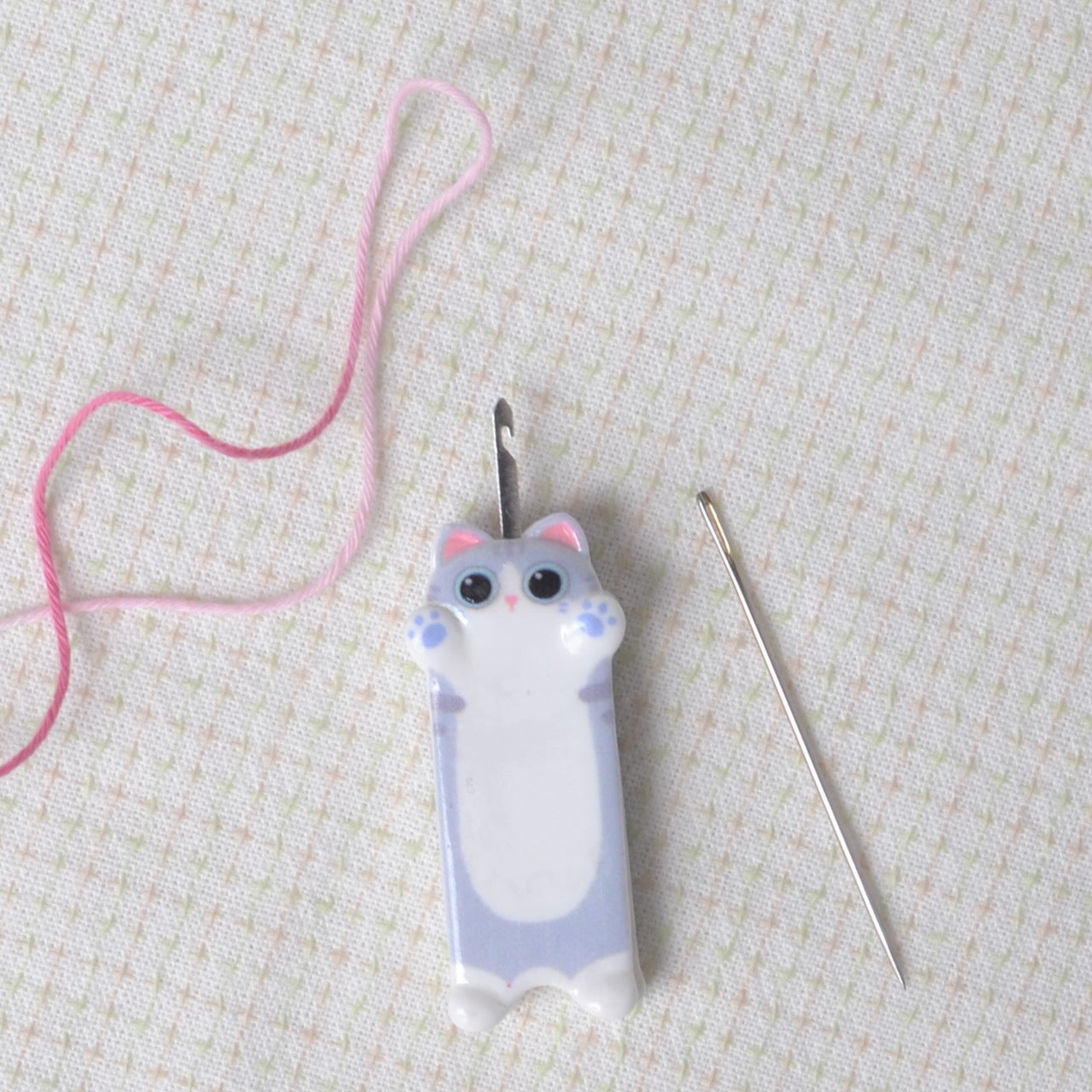 Needle threader grey kitten