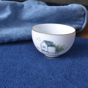 tea bowl on indigo dyed cotton fabric