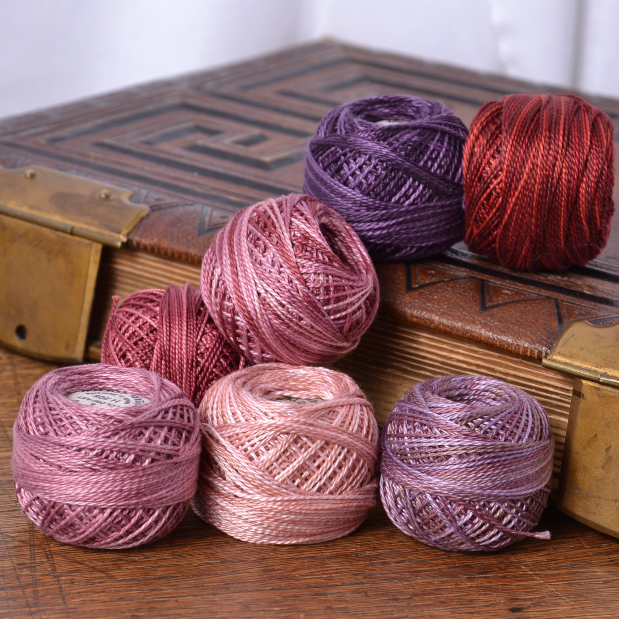perle cotton threads in pinks and purples