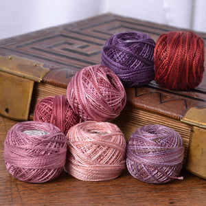 Perle cottons in pinks and reds and purples