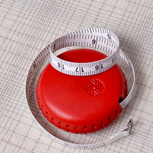 red leather sewing tape measure