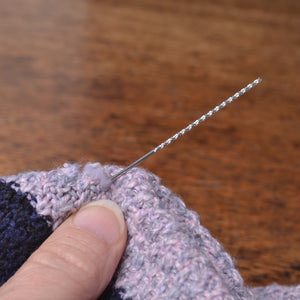 Showing  snag repair needle for repairing snagged threads on knitwear,