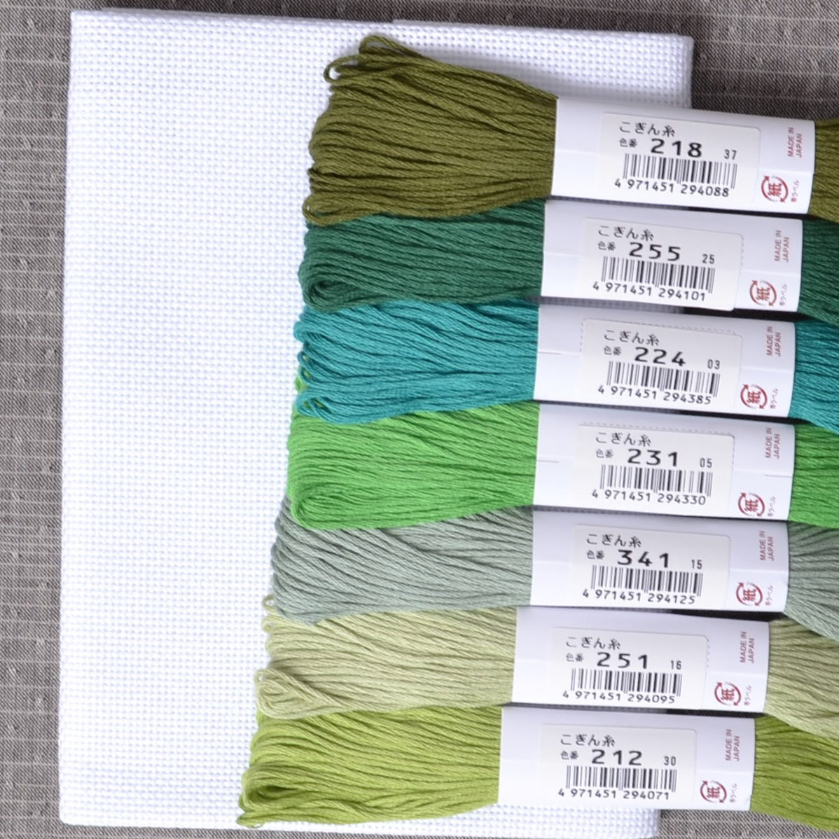 Kogin Stitching, 18 Count Taupe Grey Cloth shown with green Kogin threads
