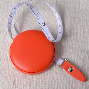 Retractable measuring tape, orange