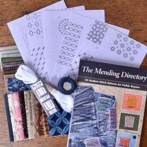 Complete mending kit includes transfer patterns, book, needle and threads