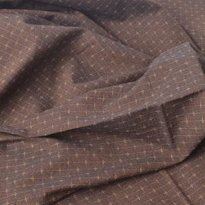 dark brown yarn dyed fabric with a fine gold grid pattern 