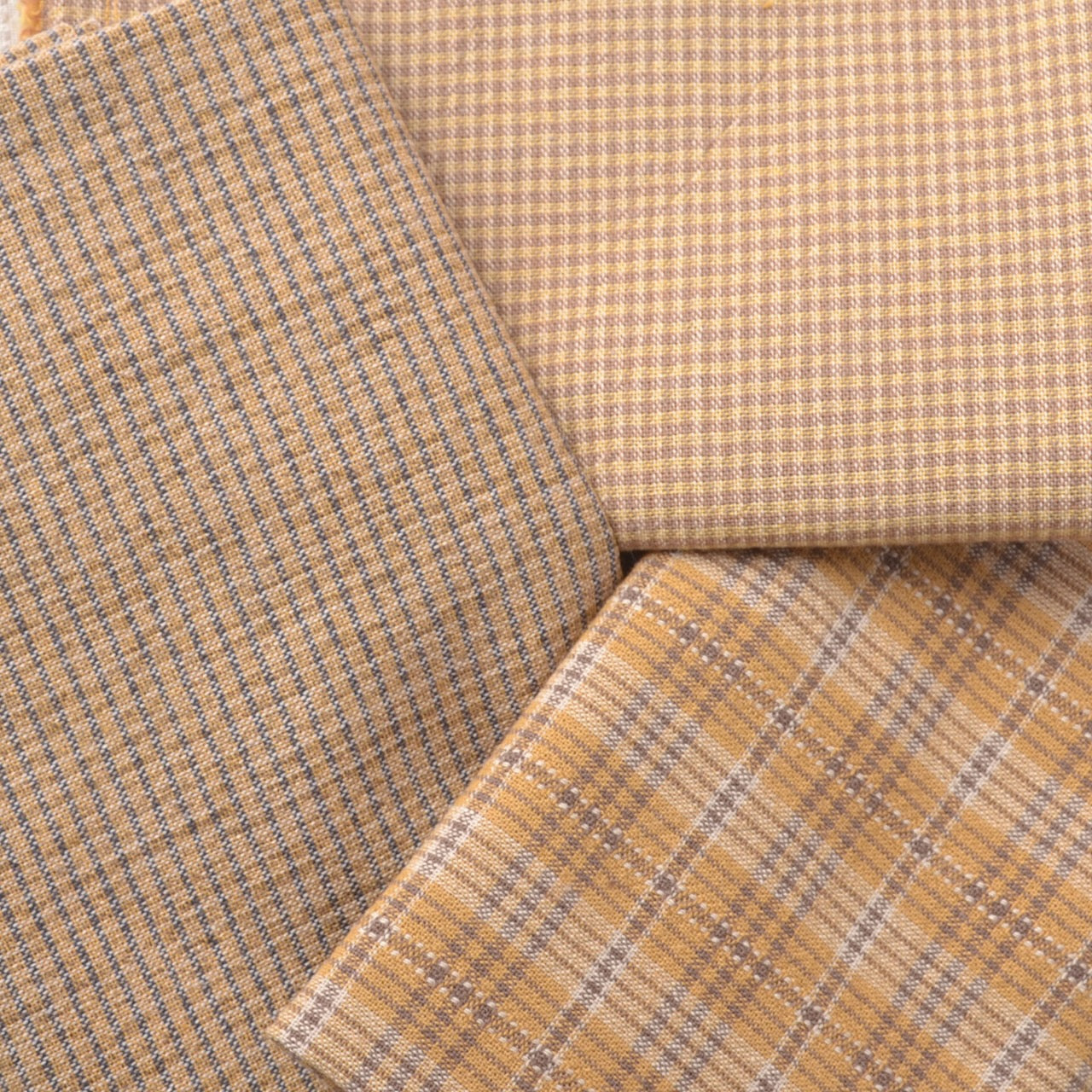 Japanese  yarn-dyed cotton fabrics, warm earthy yellows