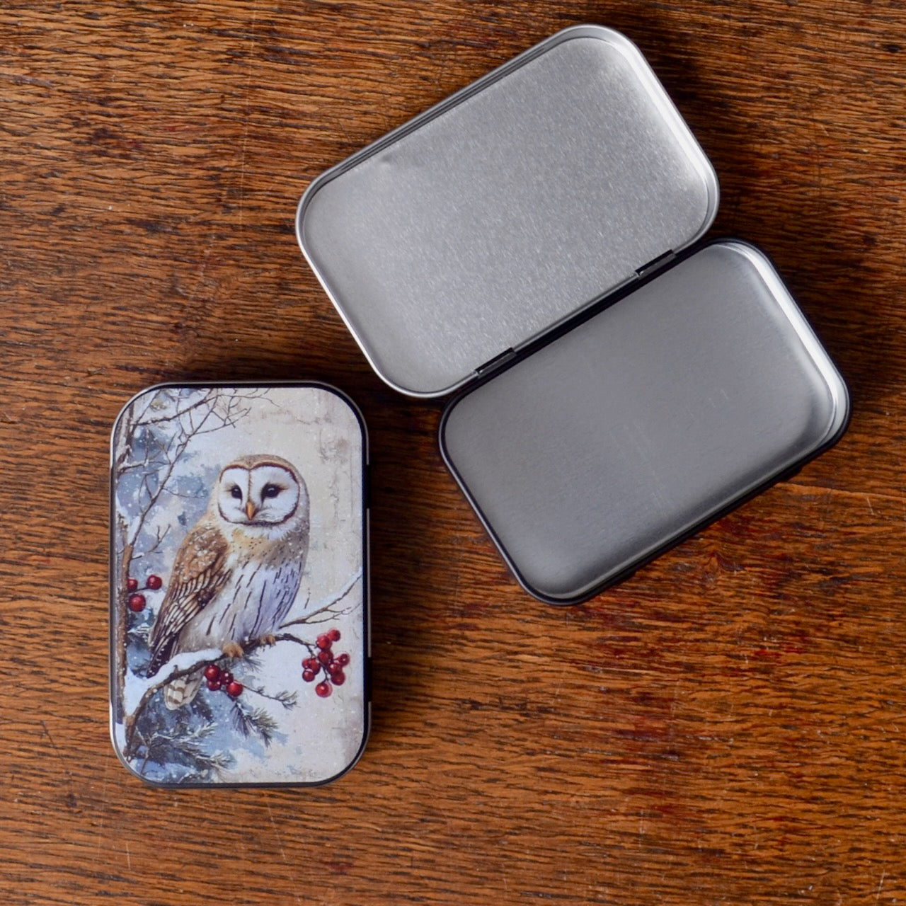 Small tin box with owl design on the surface
