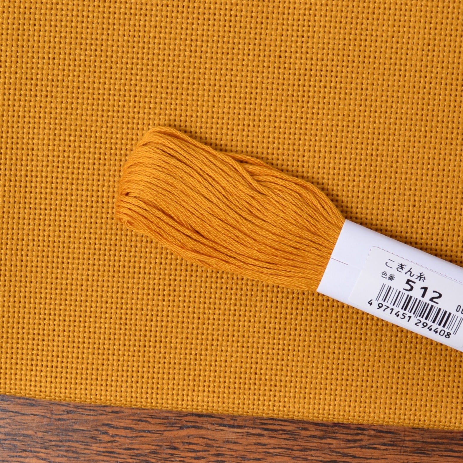 Kogin Stitching, 18 Count Gold Cloth shown with gold kogin thread