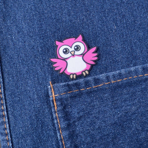 Pink iron on owl patch on a blue denim fabric