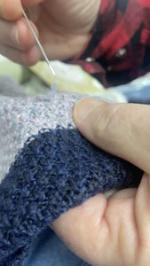 how to use a snap repair needle to fix  snagged threads on a knot sweater