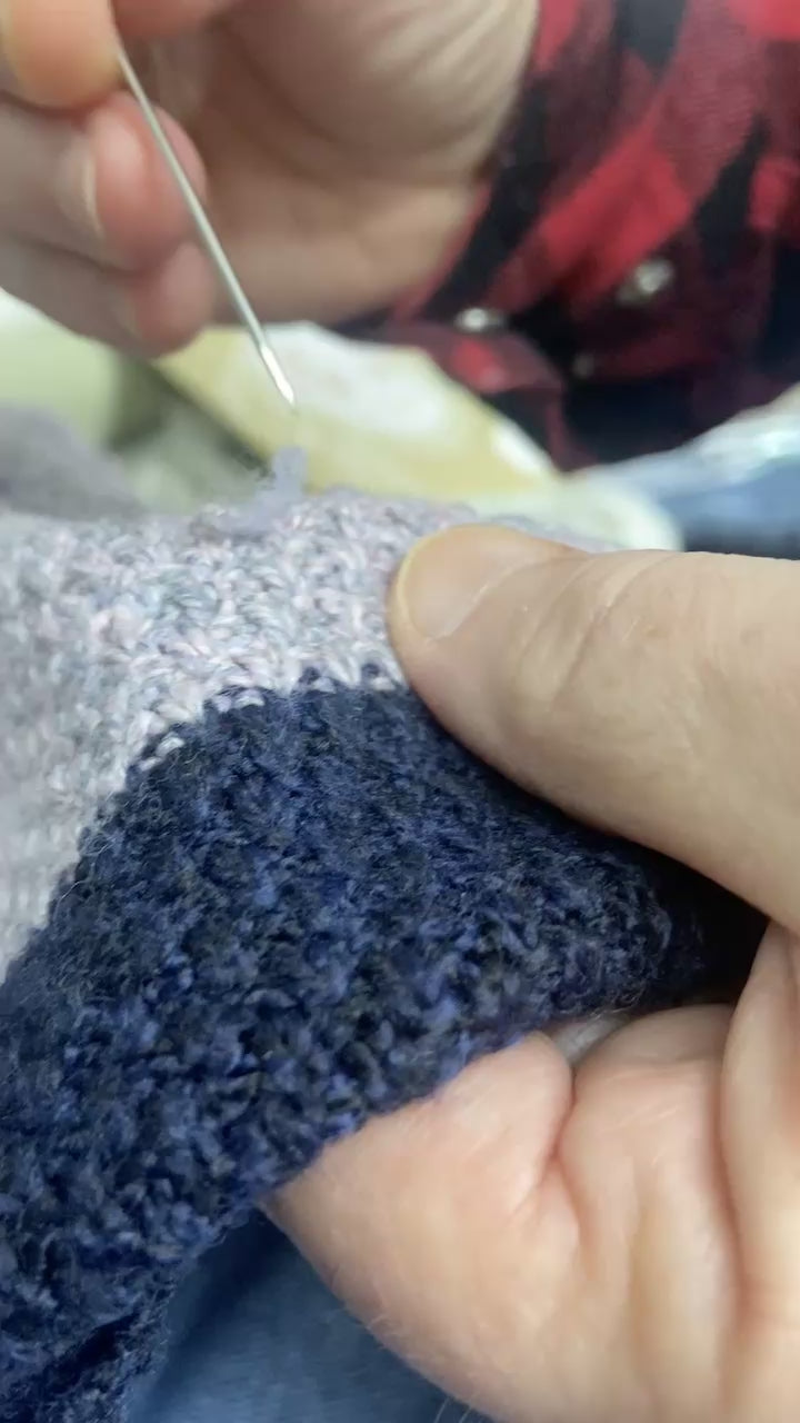 how to use a snap repair needle to fix  snagged threads on a knot sweater